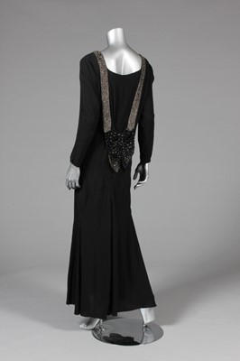 Lot 25 - A black georgette evening gown with rhinestone...