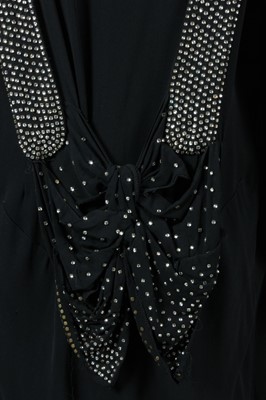 Lot 25 - A black georgette evening gown with rhinestone...