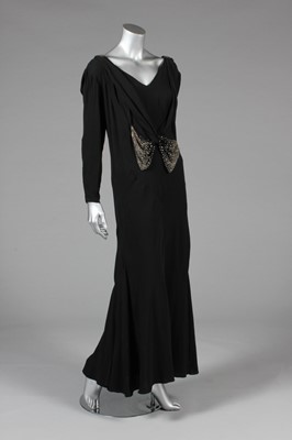 Lot 25 - A black georgette evening gown with rhinestone...