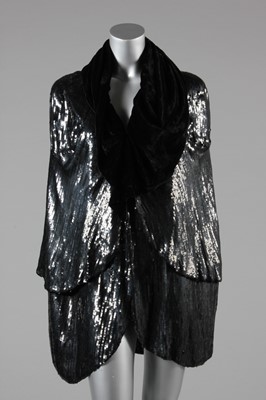 Lot 32 - A black sequined velvet evening cape, 1930s,...