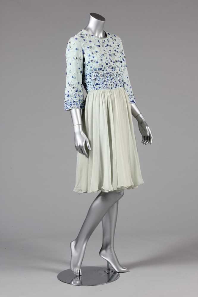 Lot 41 - A pale blue chiffon couture cocktail dress,...