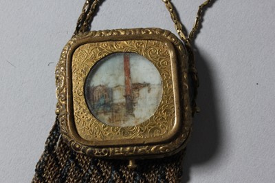 Lot 58 - A knitted silk reticule, the gilt metal...