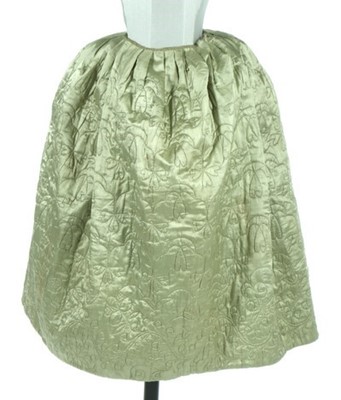 Lot 25 - A quilted pale green satin petticoat, second...