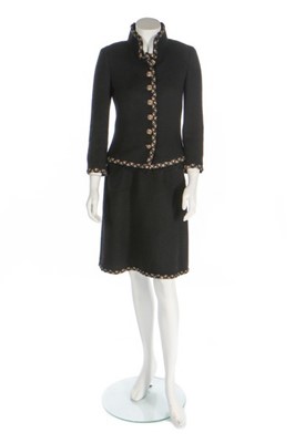 Lot 36 - A Chanel black bouclé wool ensemble trimmed...